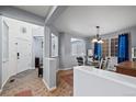 Bright entryway with tile flooring, leading to dining area at 4067 S Odessa St, Aurora, CO 80013