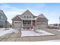 Charming two-story home featuring a well-maintained yard and a two-car garage at 848 Sandstone Cir, Erie, CO 80516