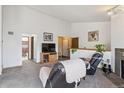 View of the living room showcases an open floor plan and easy access to the bathroom at 11337 E 1St Ave, Aurora, CO 80010