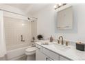 Bright bathroom with a shower and tub, updated vanity, modern fixtures and light at 3450 S Poplar St # 109, Denver, CO 80224