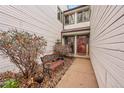 Inviting front entry with a charming sitting area and landscaping at 8404 S Everett Way # B, Littleton, CO 80128