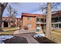 Brick building exterior with landscaping and walkway at 10125 W 25Th Ave # 47, Lakewood, CO 80215