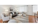 Living room with sofa, chairs, and coffee table at 10125 W 25Th Ave # 47, Lakewood, CO 80215