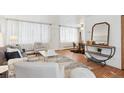Living room with sofa, chairs, coffee table, and entryway view at 10125 W 25Th Ave # 47, Lakewood, CO 80215