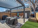 Cozy backyard with patio area, outdoor furniture, and privacy fence, perfect for relaxing at 4571 Stuart St, Denver, CO 80212