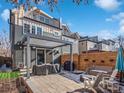 Outdoor patio area perfect for entertaining with grill, shade pergola, and lounge seating at 4571 Stuart St, Denver, CO 80212