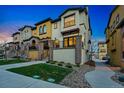 Charming home with neutral stucco, well-maintained landscaping, and an inviting entryway at 15628 W Baker Ave, Lakewood, CO 80228