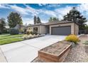 Updated mid-century ranch home with a large driveway and garden at 6620 E Virginia Ave, Denver, CO 80224