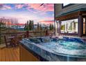 Relaxing hot tub on a wooden deck with scenic mountain views at 185 S Fuller Placer Rd, Breckenridge, CO 80424