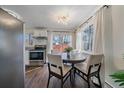 Cozy breakfast nook with a stainless steel range and bright natural light at 3738 Miller Ct, Wheat Ridge, CO 80033