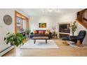 Bright living room boasts wood floors, fireplace, and ample natural light at 1927 Pine St # B, Boulder, CO 80302
