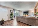 Comfortable living room features beautiful wood floors and lots of natural light at 2904 S Idalia St, Aurora, CO 80013