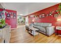 Spacious living room with ample seating, hardwood floors, and decor at 1425 S Newport St, Denver, CO 80224