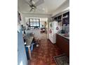 Functional kitchen space with wood floors and a view into the living room at 1265 Yates St, Denver, CO 80204