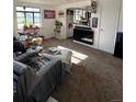 Inviting living room featuring plush carpeting, bright windows, and a cozy atmosphere at 1265 Yates St, Denver, CO 80204