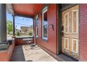 Cozy covered porch with a small table and chairs, string lights, and a view of the surrounding neighborhood at 1103 Lipan St, Denver, CO 80204
