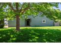 Inviting exterior view of a two-story home featuring a well-maintained lawn and mature shade tree at 4248 Corriente Pl, Boulder, CO 80301