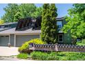 View of house with solar panels on the roof, and a mailbox stand in front at 4248 Corriente Pl, Boulder, CO 80301