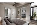 Comfortable bedroom with a large window and views to living room and ensuite bathroom at 1643 Boulder St # 205, Denver, CO 80211