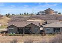 Back exterior view of home with a fenced yard and view of the surrounding landscape at 4475 Hidden Gulch Rd, Castle Rock, CO 80104
