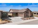 Charming single-Gathering home with a stone and siding exterior, complemented by a well-manicured lawn and a spacious driveway at 4475 Hidden Gulch Rd, Castle Rock, CO 80104