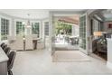 Open dining room extends to outdoor patio through French doors at 18 Foxtail Cir, Englewood, CO 80113