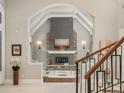 Living room boasts stone fireplace, high ceilings, and elegant design elements at 18 Foxtail Cir, Englewood, CO 80113
