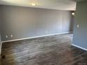 Spacious living room with grey walls, modern laminate flooring, and ample natural light at 3613 S Olathe St, Aurora, CO 80013