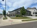 Corner lot home with well-kept lawn and landscaping at 5204 Lake Port Ave, Longmont, CO 80504