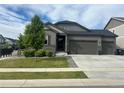 Attractive single-Gathering home featuring a three-car garage and a well-maintained front yard at 5204 Lake Port Ave, Longmont, CO 80504