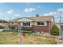 Lovely home exterior with a well-manicured lawn and charming front porch at 3540 E 90Th Pl, Thornton, CO 80229