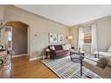 Inviting living room featuring hardwood floors, neutral paint, and modern furnishings at 1610 Trenton St, Denver, CO 80220