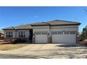 Charming single-story home featuring a tile roof and an attached two-car garage at 4971 Bross Pl, Broomfield, CO 80023