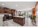 Spacious kitchen with stainless steel appliances and a large center island at 11883 E 111Th Ave, Commerce City, CO 80640