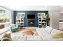 Cozy living room with fireplace, built-in bookshelves, and comfortable seating area at 2242 W 34Th Ave, Denver, CO 80211