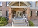 Inviting front entrance of a brick building with stone accents and prominent numbering at 6435 S Dayton St # 103, Englewood, CO 80111
