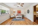 Inviting living room with hardwood floors, a ceiling fan, and a bright window at 1687 S Field Ct, Lakewood, CO 80232