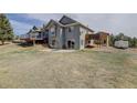 Rear view with a spacious patio, and a large outdoor living space at 10510 Inspiration Dr, Parker, CO 80138