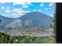 Scenic mountain view from the home, showcasing lush greenery and open space at 4522 S Robb St, Littleton, CO 80127