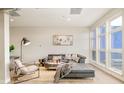 Bright and airy living room featuring modern furniture, large windows, and stylish decor at 3198 Blake St # 502, Denver, CO 80205