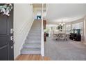 Spacious entryway with staircase and open view into the dining and living areas at 11866 High Desert Rd, Parker, CO 80134
