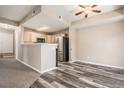 Open kitchen with stainless steel appliances and wood-look flooring at 8707 E Florida Ave # 709, Denver, CO 80247