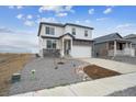 Beautiful home exterior featuring stone accents, a well-maintained yard, and a two-car garage at 8322 E 134Th Pl, Thornton, CO 80602