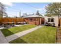 Landscaped backyard with a patio area, perfect for entertaining and relaxing at 3085 W 36Th Ave, Denver, CO 80211