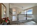 Inviting entryway with a staircase, stylish gray flooring, and modern decor, creating a warm welcome at 13612 Plaster Cir, Broomfield, CO 80023
