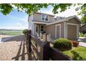 Well-maintained home with a charming fence, a manicured yard, and a convenient attached single-car garage at 2296 E 109Th Dr, Northglenn, CO 80233