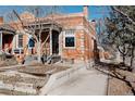 Charming brick home showcasing a well-maintained yard and classic architectural details at 1788 S Sherman St, Denver, CO 80210