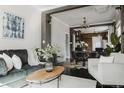Cozy living room with stylish furniture, exposed brick accents, and an open floor plan at 1788 S Sherman St, Denver, CO 80210