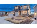 Stunning two-story home featuring stone accents, a two-car garage, and an inviting front yard at 2957 Eagle Wing Way, Castle Rock, CO 80109
