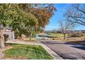 Beautiful home exterior overlooking a lush golf course and scenic water feature, enhancing curb appeal at 1913 Five Iron Dr, Castle Rock, CO 80104